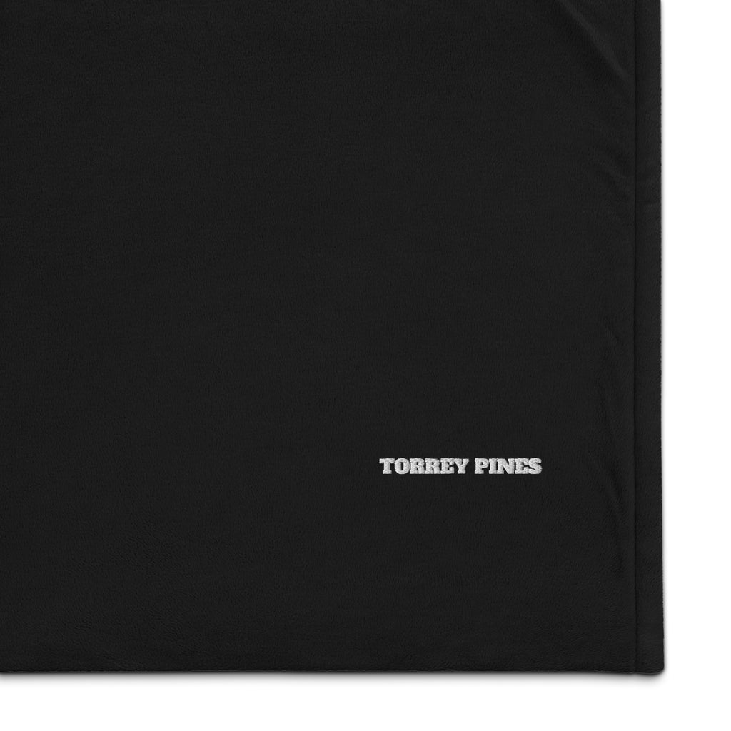Close view of the embroidery on the golf blanket