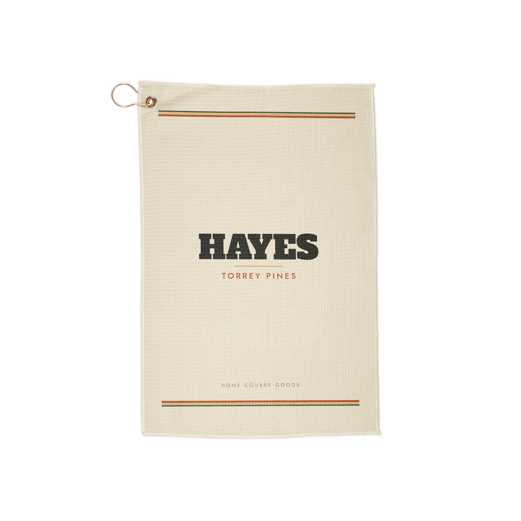 A personalized microfiber golf towel with the golfer's name printed across it