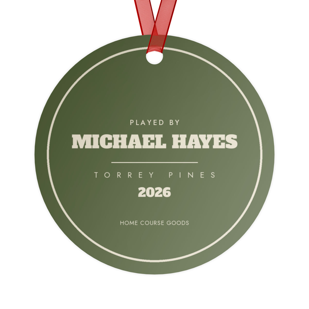 The back of the golf ornament, printed with the golfer's name, the course and the year