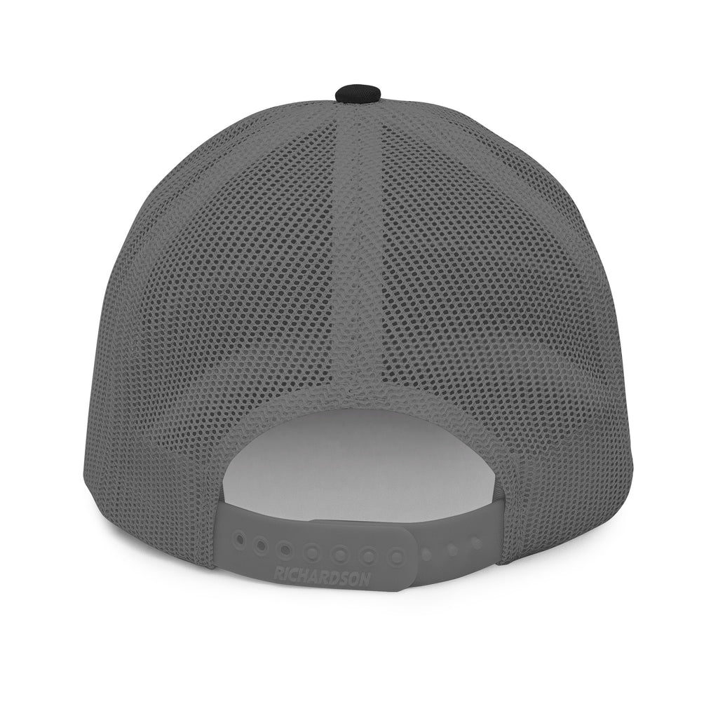 The embroidered trucker cap seen from a low angle